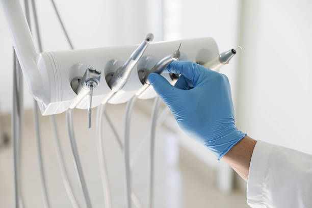 Professional Emergency Dentist technician working in Skidway Lake, MI